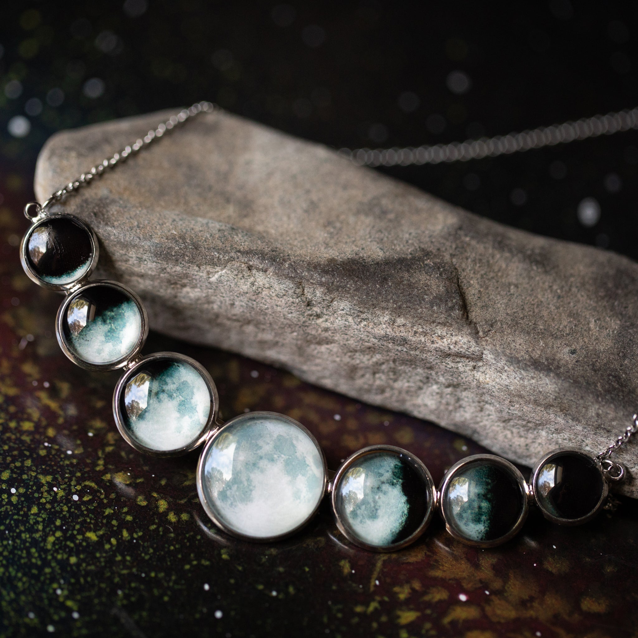 Varying Sized Curved Moon Phase Necklace in Silver
